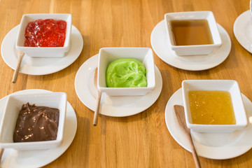 Jam spreads several flavors served buffet.