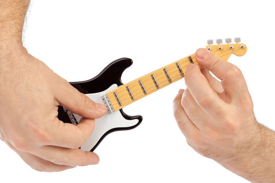 Hands And Toy Electric Guitar