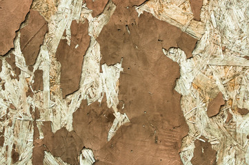 Abstract texture of peeling plaster brown color