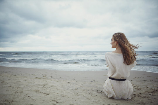 Beautiful Alone Girl On The Beach