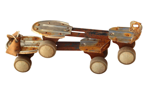 Old rusty roller skates, isolated on white
