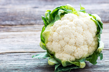 Cauliflower on wooden background
 - obrazy, fototapety, plakaty