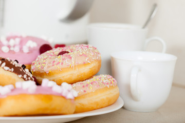 Obraz na płótnie Canvas donuts on kitchen table.