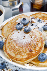 tasty pancakes with fresh blueberries and honey for breakfast