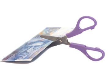 One hundred swiss franc banknotes with scissors.currency of swit - obrazy, fototapety, plakaty