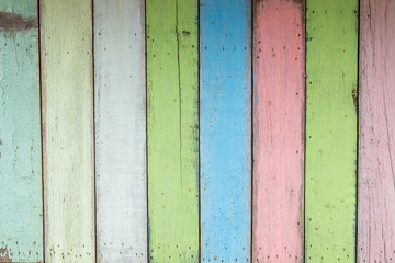 Old painted colorful wooden wall.