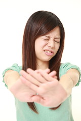  young Japanese woman making stop gesture