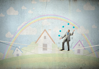 Businessman juggling with balls