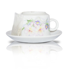 Elegant white cup and saucer with floral decorations