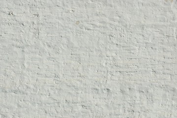 Old Uneven Brick Wall With White Painted Plaster Background