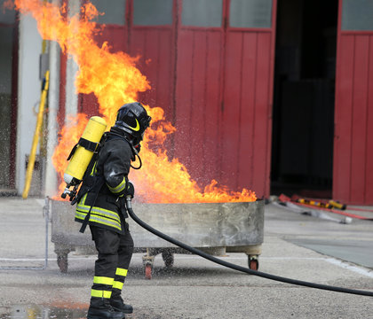 firefighters with oxygen bottles off the fire during a training