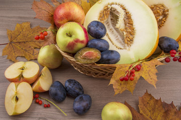 Melon,apples and plums of autumn still life