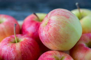 Apples on old wooden background.