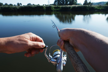 Rod in fisherman hands