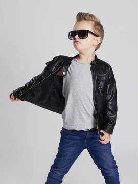 Fashionable child in leather coat.little boy in sunglasses