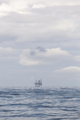 Fototapeta na wymiar Drilling rig at cloudy day