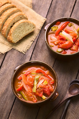 Hungarian traditional dish called Lecso, a vegetarian stew made of onion, pepper, tomato (Selective Focus, Focus in the middle of the first dish)