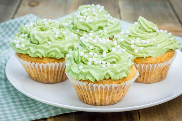 Healthy muffins with ricotta cheese and matcha frosting