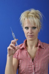 Obraz premium Portrait of Nurse Holding a Syringe