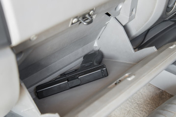 Gun in car console, Concept for article