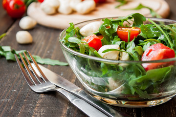 Caprese salad with mozzarella, tomatoes and arugula