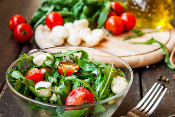 Caprese salad with mozzarella, tomatoes and arugula