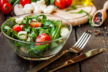 Caprese salad with mozzarella, tomatoes and arugula