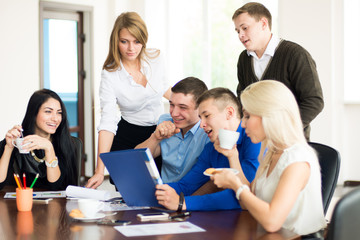 A group of young business people in the office having fun discus
