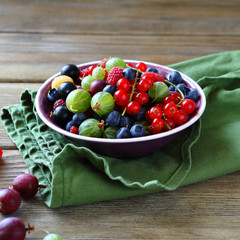 summer berry in small bowl on green napkin