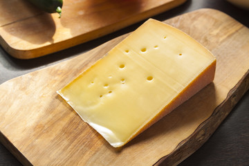 Parmesan cheese on cutting board