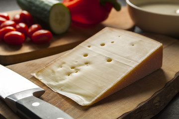 Parmesan cheese on cutting board