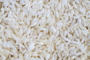 White long rice background, uncooked raw cereals, macro closeup