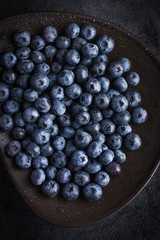 Fresh  bueberry on black plate