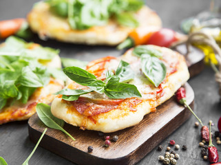 Mini Pizzas with Mozzarella, Cheese, Tomato Sauce and Fresh Basi