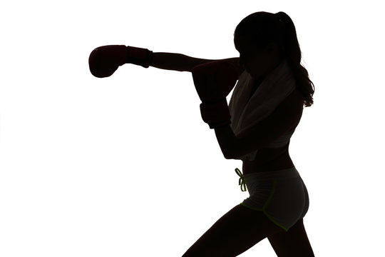one caucasian woman boxing exercising in silhouette studio isola