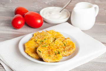 fried zucchini fritters with dill on a plate