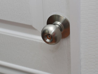 stainless steel round ball door knob close up view, modern door