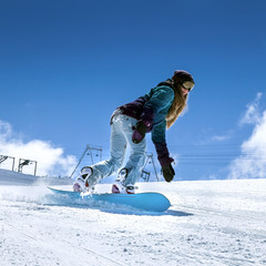 Snowboarder moving down