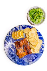 roasted pig with potatoes ans lettuce