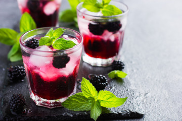 refreshing cocktail with blueberry, ice and mint,