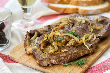 Fried pork chops with caramelized onions