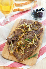 Fried pork chops with caramelized onions