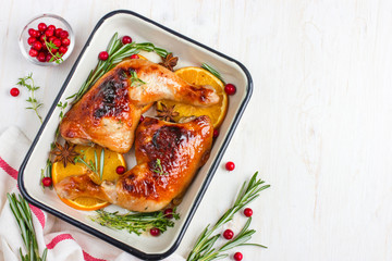 roasted chicken leg with orange and spicy herbs