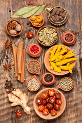 Spices and spicy on a wooden background. Top view