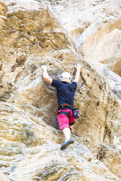 Young man climbing