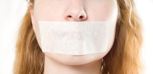 woman with mouth sealed