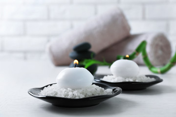 Composition of spa treatment on table, on white background