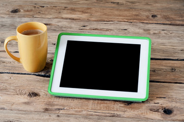 Tablet computer with coffee cup