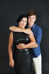 Portrait of mother and her son on dark background