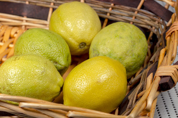 Lemons into a wicker basket